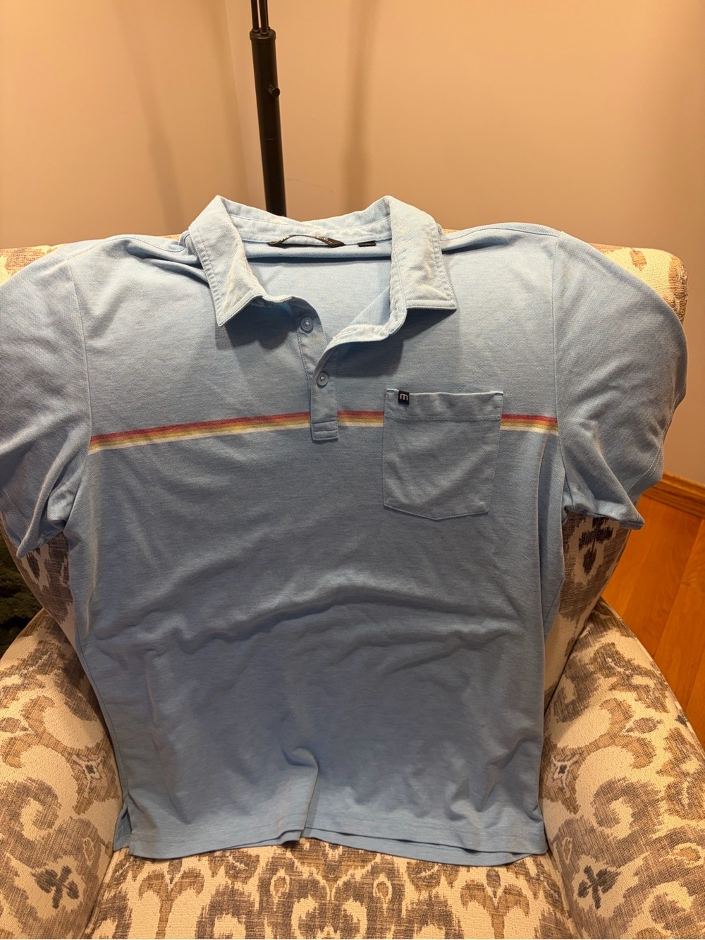 Travis Mathew Light Blue Polo with Rainbow Chest Stripe